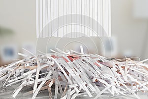 Blank Shredded paper above Cut up credit cards with Shredded Bills and Bank Statements