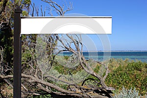 Blank sign board along the sea, destination scenics