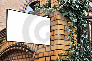 Blank sign on brick facade mock up