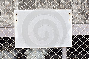 Blank sign on chain link fence