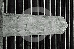 Blank Sign Post Shot against Corrugated Iron Background in Black and White