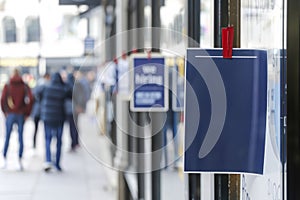 A blank sign in a shop window. Copy space for text