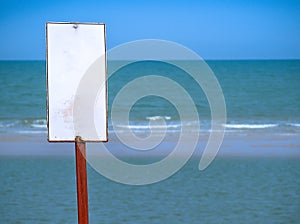 Blank sign for swimmers at the beach