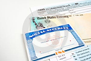 Blank social security card, united states treasury stimulus check and 1040 us individual tax income return