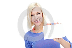 Blank space just for you. A beautiful young woman holding a blank card while isolated on a white background.