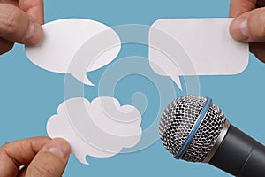 Blank speech bubbles with microphone