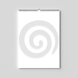 Blank spiral binding wall calendar mock up on dry wall. 3D illus