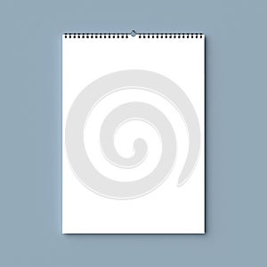 Blank spiral binding wall calendar mock up on dry wall. 3D illus