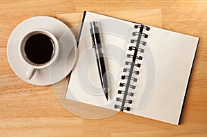 Blank Spiral Note Pad, Cup and Pen on Wood
