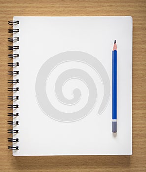 Blank spiral notebook and pencil