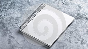 Blank Spiral Notebook on a Textured Grey Surface