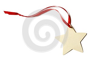 Blank, star-shaped Christmas gift tag with red ribbon isolated on white background