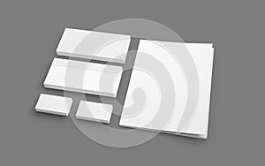 Blank stationery isolated on grey. Envelopes, folder and business cards.