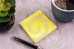 Blank sticky adhesive note with a cup of coffee