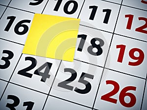 Blank sticky note on a calendar
