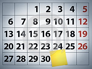 Blank sticky note on a calendar