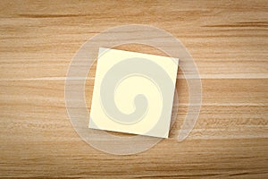 Blank Sticky Note On The Wooden Table