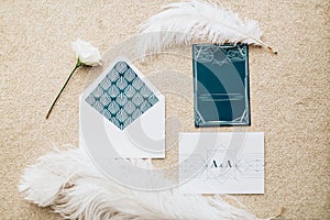 Blank stylized romantic invitation on carpet background. Top view