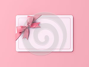 Blank sweet gift card or gift voucher with pink ribbon bow isolated on pink pastel color background