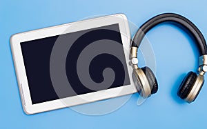 Blank tablet with wireless headphone for Music application mock up