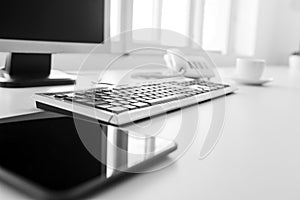 Blank tablet, keyboard and desktop computer