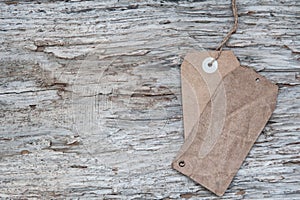 Blank tag retro style on old wood texture