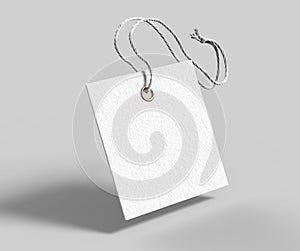 Blank tag tied with string. Price tag, gift tag, sale tag, address label isolated on grey background. 3d render illustration