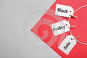 Blank tags on color background, space for text. Black Friday concept