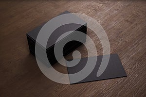 Blank template black Business Cards on wooden background. 3D rendering.