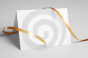 Blank thank you card with golden ribbon