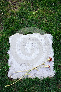 Blank tombstone with flower