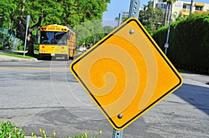 Blank traffic sign and school bus