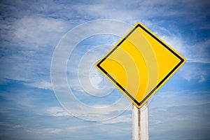 Blank on traffic sign on yellow background with cloudy blue sky. symbol for transportation regulations. image for background
