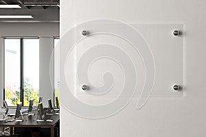 Blank transparent glass sign plate on the wall