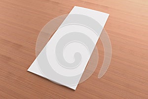 Blank tri fold brochure on wooden background