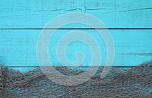 Blank turquoise aged wooden sign with fish net border