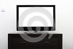 Blank tv screen on brown commode photo