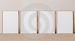 Blank vertical poster frame mock up standing on beige floor. Four wooden frames isolated in Scandinavian interior