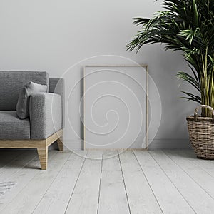 Blank vertical poster frame mock up standing on white wooden floor in light modern minimalist interior with white wall and grey