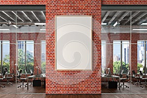 Blank vertical poster mock up on the red brick wall in office interior.