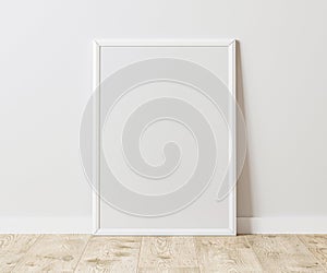 Blank Vertical white frame on wooden floor with white wall, 3:4 ratio, 30x40 cm, 18x24 inches, poster frame mock up, 3d rendering.