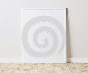 Blank Vertical white frame on wooden floor with white wall, 4:5 ratio - 40x50 cm, 16 x 20 inches, poster frame mock up, 3d renderi