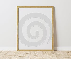 Blank Vertical wooden frame on wooden floor with white wall, 4:5 ratio - 40x50 cm, 16 x 20 inches, poster frame mock up, 3d render