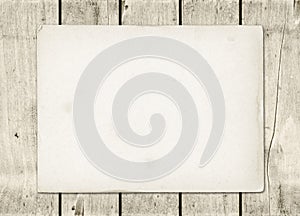 Blank vintage paper sheet on a white wood board