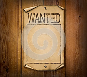 Blank wanted poster on wooden background