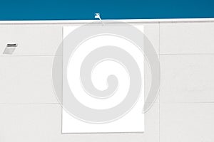 Blank white big vertical mockup advertising sign on store, shop, shopping mall building. Empty banner mock up template