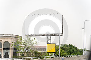 Blank White Billboard with Blue Sky Clouds and Trees. focus on blank big billboard on highway in city town Bangkok