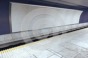 Blank white billboard on violet wall in empty subway