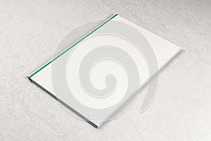 Blank white book on concrete background
