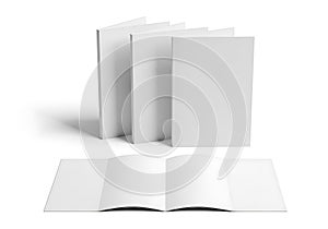 Blank white book covers arranged in a stack and an open book on a white background
